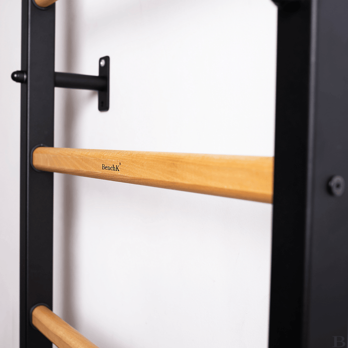 Close-up view of a black BenchK wall bar, focusing on the branded BenchK logo, highlighting its quality craftsmanship