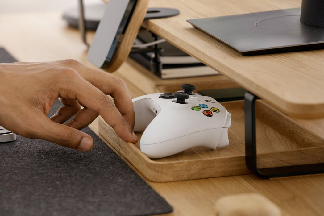 Oakywood Catch-All Tray Holding Gaming Controllers and Accessories | Versatile Use Case Display - at home office - side angle.